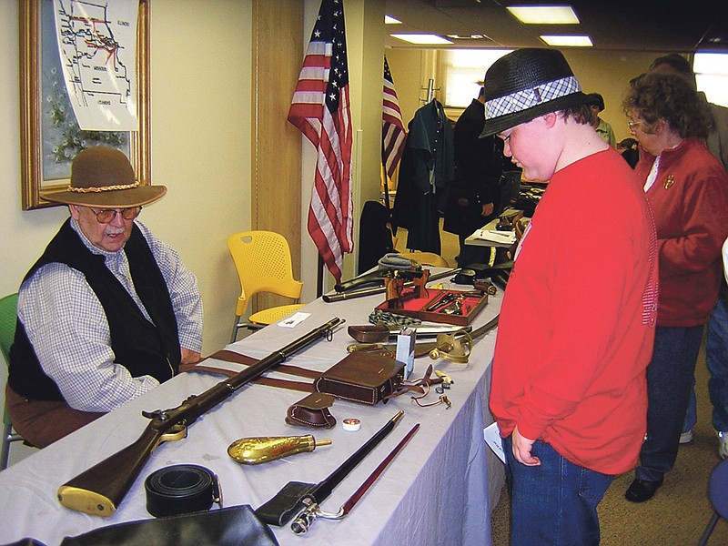 Contributed photo: The Kingdom of Callaway Civil War Heritage's fourth annual Civil War Living History Day will be observed from 11 a.m. to 3 p.m. Saturday with an event for children at the Callaway County Public Library. The event, which is geared toward families and youngsters from ages 5 to 13, will feature living history re-enactors, period music and food. Pictured is Jim Harrison (seated) at the 2009 event.