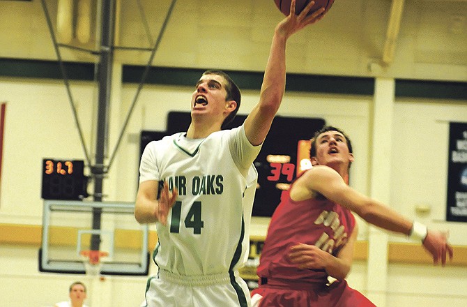 
Brandon Moore of Blair Oaks goes up for a layup while Lance Baker of Dixon defends during Wednesday night's Class 3 sectional at Missouri S&T in Rolla. 