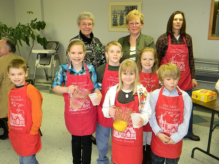 Children and adults helped pass out pancakes, sausages and drinks at the Annual Pancake and Sausage Breakfast held Sunday, March 13 at St. Paul's Lutheran Church, Lohman.