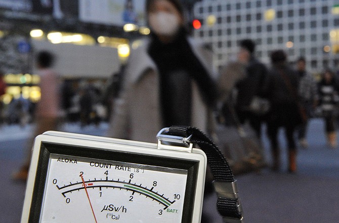 A radiation detector marks 0.6 microsieverts on Tuesday, exceeding normal day data, near Shibuya train station in Tokyo.