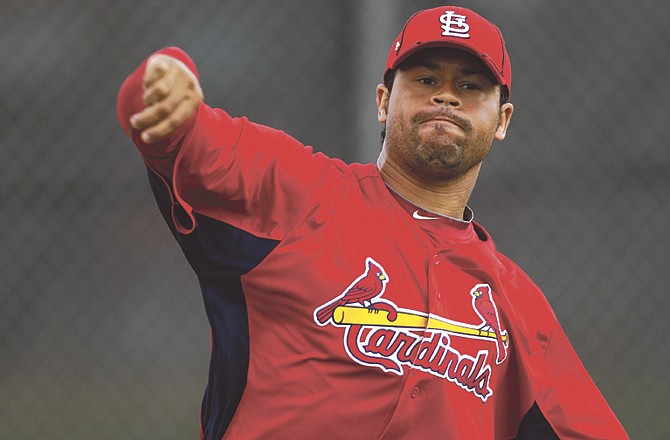 Ian Snell tosses the ball during a workout last month in Jupiter, Fla. Snell has decided to retire after the Cardinals optioned him to the minor leagues Tuesday. 