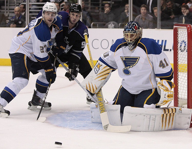 St. Louis Blues goalie Jaroslav Halak, right, of Slovakia, watches the puck as St. Louis Blues defenseman Alex Pietrangelo, left, and Los Angeles Kings left wing Ryan Smyth fight for position during the second period of an NHL hockey game, Thursday, March 17, 2011, in Los Angeles.