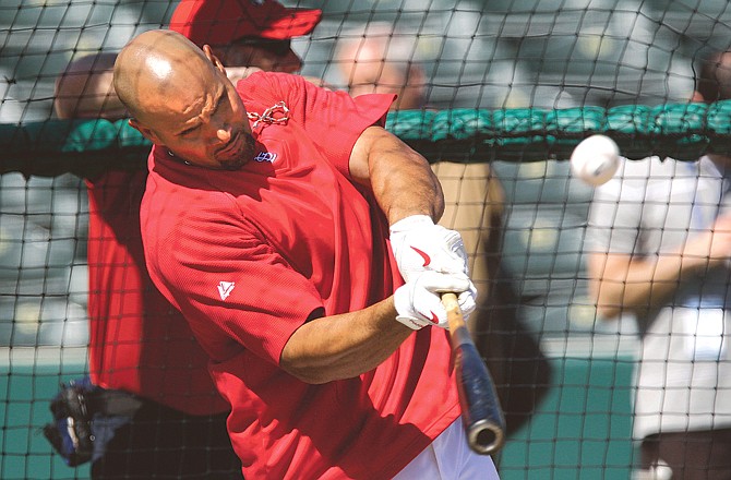 Albert Pujols of the Cardinals takes batting practice earlier this month before a spring training game against the Red Sox in Jupiter, Fla. Pujols is putting together one of his best spring trainings this year.