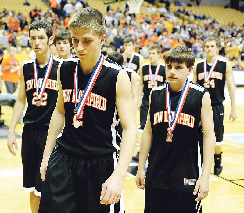 New Bloomfield senior guard Aaron Bedsworth leads his teammates off the court at Mizzou Arena after the Wildcats' 90-67 loss to Wellington-Napoleon in the Class 2 third-place game Friday night in Columbia.