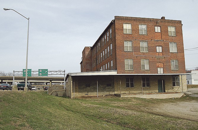 Once a shoe factory and then a furniture store, this Millbottom-area building was cited as a potential redevelopment project, complete with a conceptual drawing. It was a surprise to building trustee Gene Schneider. 