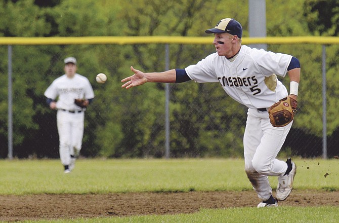 Helias' Quintin Matheis, shown starting a double play last season, returns at second base for the Crusaders. (File photo)