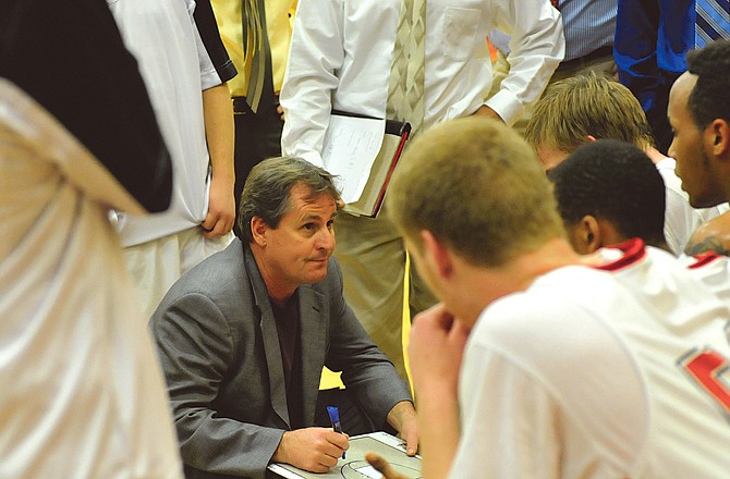 Jays head basketball coach David Fox talks with his team during a game this season at Fleming Fieldhouse. Fox announced Wednesday he was stepping down after 25 years with the program, the last 17 as head coach.