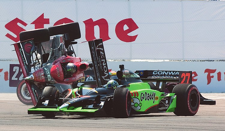 Marco Andretti (26) and Mike Conway crash in the first turn of the opening lap of Sunday's Grand Prix of St. Petersburg in St. Petersburg, Fla. 