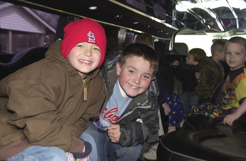 Mandi Steele/FULTON SUN photo: Second-graders (from left) Kandon Sheley and Austin Taylor sit inside a limousine on Monday awaiting their drive to Fulton Pizza Hut.   