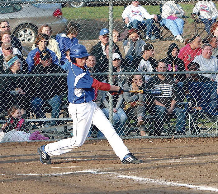 California's Johnathan Trachsel connects with a pitch during the fourth inning of the Pintos' varsity game against Cole Camp. Trachsel led the Pintos with three hits and three RBI.