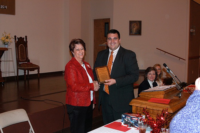 Judy Wittenberger is presented the award as Republican of the Year by Club President Caleb Jones at the annual Lincoln Day dinner.