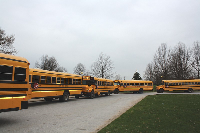Mandi Steele/FULTON SUN photo: Buses line up at Fulton High School at the end of the school day Tuesday, March 29, 2011. 