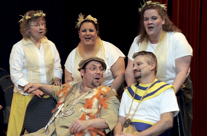 
The Spirits of Light (Marie Duggan, Jennifer Fults and Sonya Forck) sing to Papagena (Ian Linenfelser) and Tamino (Bill Lehman) during a rehearsal for Mozart's "The Magic Flute." 