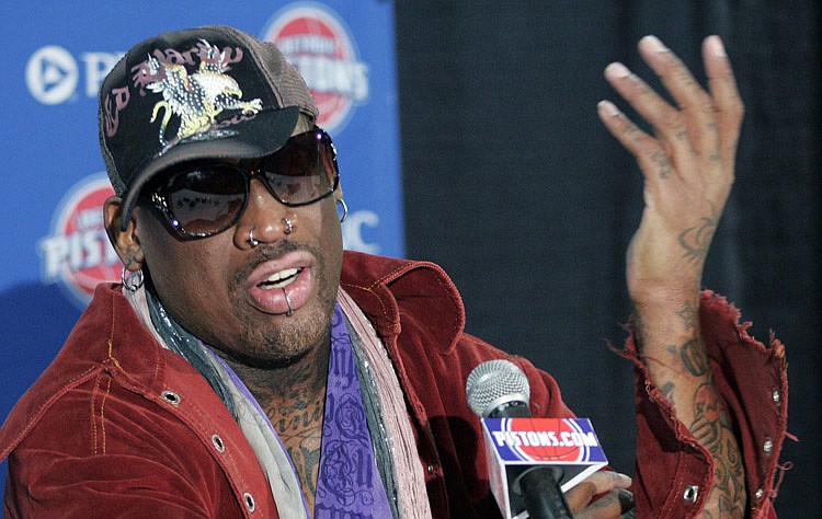 Former Detroit Piston Dennis Rodman gestures while addressing the media during a press conference at The Palace before an NBA basketball game against the Chicago Bulls Friday, April 1, 2011, in Auburn Hills, Mich. Rodman, who won two NBA Championships with the Pistons in 1989 and 1990, is being honored with the retirement of his No. 10 jersey during a half-time ceremony.