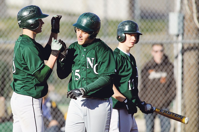 Dak Dillon/FULTON SUN photo: North Callaway's Zach Lavy (left) congratulates Collin Brinker after his two-run home run in the third inning of Friday's game at Hensley Field. The Thunderbirds overcame a six-run deficit to clip the Hornets 7-6.