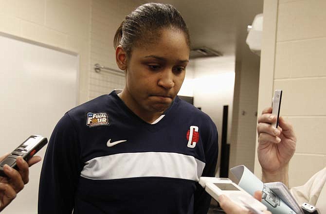 Connecticut's Maya Moore is interviewed after Connecticut's 72-63 loss to Notre Dame in a women's NCAA Final Four semifinal college basketball game in Indianapolis, Monday, April 4, 2011.