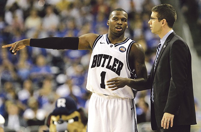 Butler's Shelvin Mack talks to head coach Brad Stevens during Saturday night's win over Virginia Commonwealth in the semifinals of the NCAA tournament in Houston. Butler will face Connecticut for the championship tonight. 