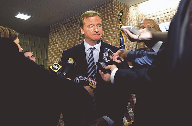 NFL Commissioner Roger Goodell talks with reporters Monday after an assembly about the dangers of steroid use at Woodlawn High School in Woodlawn, Md. 