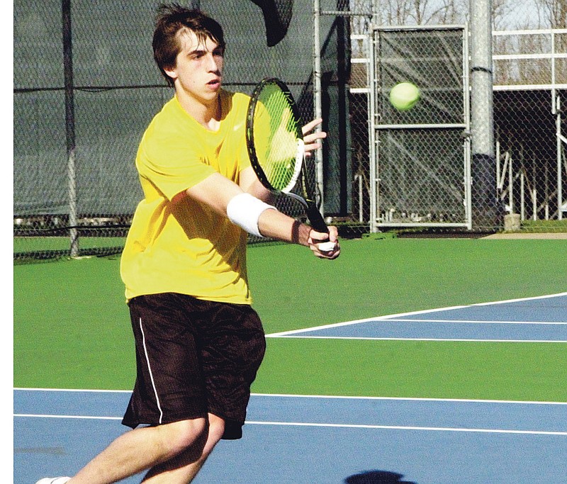Ryan Boland/FULTON SUN photo: Fulton senior Sean Flynn hits a forehand return during his 10-8 victory over MMA's Jorge Aguilar at No. 2 singles on Tuesday at the high school sports complex. Flynn and the Hornets were eventually edged by the Colonels 5-4.