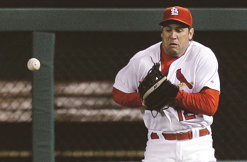 Cardinals right fielder Lance Berkman, shown misplaying a ball Monday night against the Pirates, has made some notable errors so far this season.