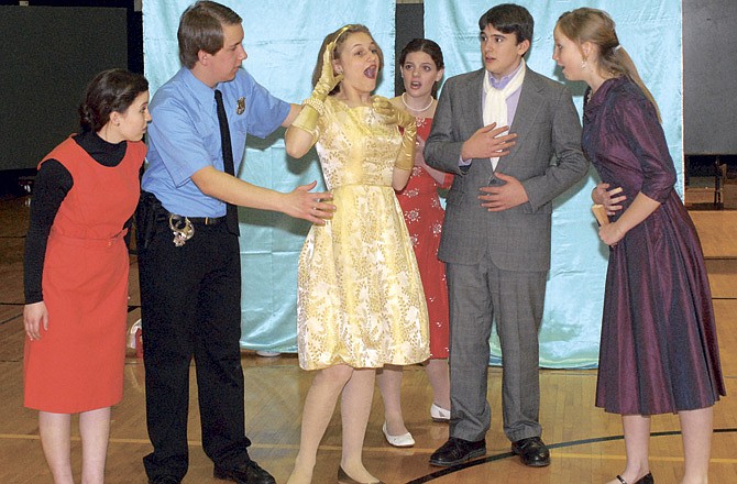 Anna Bommel, Jake Wise, Annelise Schulte, Erin Stephens, Timothy Bommel and Ulzii Hoyle from the Jefferson City Home Educators run through a scene from the musical "Drat! The Cat!" by Ira Levin.