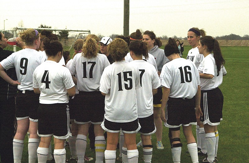 Ryan Boland/FULTON SUN photo: Fulton Lady Hornets soccer coach Kati Wallace (center) talks to her squad before Thursday night's NCMC matchup against Hannibal at Morgan Soccer Complex. The Lady Hornets improved to 7-0 overall and 4-0 in conference play with their seventh shutout of the season - 3-0 over the Lady Pirates.