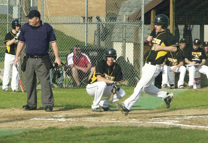 Ryan Boland/FULTON SUN photo: Fulton senior second baseman Alex Thomas scores on a wild pitch in the bottom of the third inning in the Hornets' NCMC game against Hannibal on Friday night at Hensley Field. Fulton watched its two-game winning streak come to an end in a 4-3 loss to the Pirates.