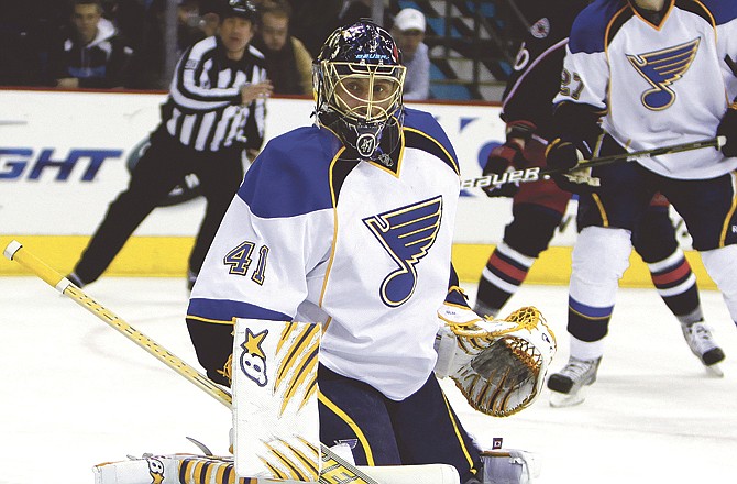 St Louis Blues goalie Jaroslav Halak (41), of Slovakia, looks for the puck after he blocked a shot during a game against the Columbus Blue Jackets Sunday, April 3, 2011, in Columbus, Ohio.