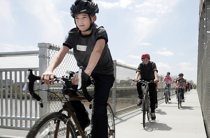 In celebration of 2011 Bicycle and Pedestrian Day at the Missouri Capitol, people were invited to ride across the just-opened bicycle/pedestrian lane attached to the Missouri River Bridge.