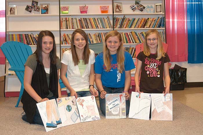 California Elementary studentshave written a youth book on autism. From left, illustrator Lindsey Morris with elementary school book writers Elizabeth Lutz, Halle Oliver and Allee Koestner. Morris is a seventh grader. The three writers are fifth graders.