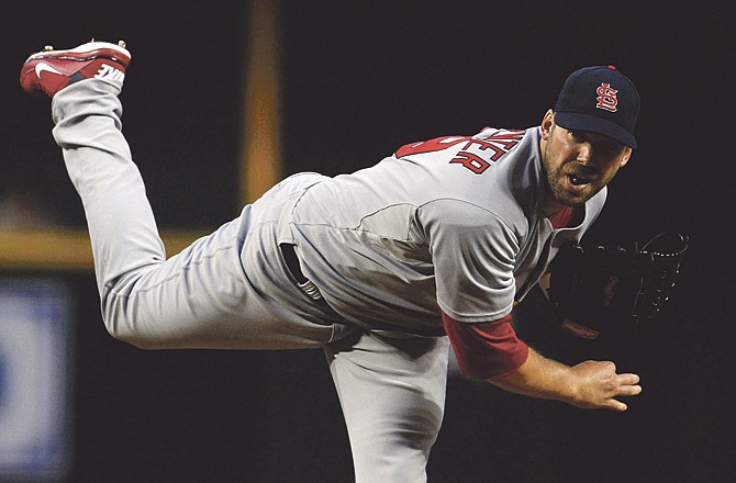 St. Louis Cardinals' Chris Carpenter throws against the Arizona Diamondbacks in the first inning of a baseball game Tuesday, April 12, 2011, in Phoenix.