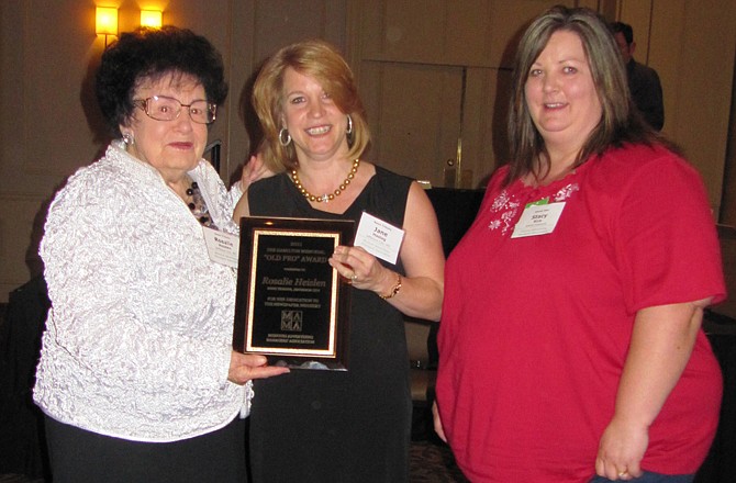 Rosalie Heislen (left) is presented the Dee Hamilton Old Pro Award at the Missouri Ad Managers Association annual meeting. Heislen, an advertising saleswoman for the News Tribune for more than 65 years, is presented the award Thursday by Jane Haslag (center), News Tribune advertising director, and Stacy Rice, president of the Missouri Advertising Manager's Association. 