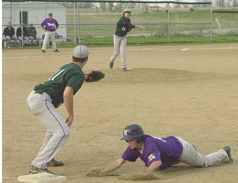 North Callaway sophomore starter Justin Murphy tries to pick off Hallsville senior shortstop Garrett Strodtman in the first inning of a pool-round game of the Montgomery County Tournament played at Auxvasse on Thursday night. The Thunderbirds downed the Indians 9-5, then faced off against South Callaway late Thursday night. Results were not available at press time.