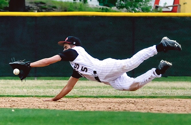 Jays second baseman Connor Hager makes a diving catch during Monday's game against the Hickman Kewpies at Vivion Field.