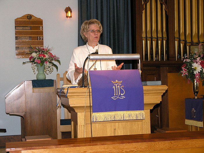 The Rev. Janet Deneke, pastor at Grace United Methodist Church, Jamestown, gives the Palm Sunday message titled "Who Do You Say That He Is?" at the service held April 17.