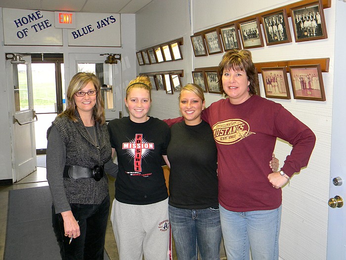 High Point Teacher Cathy Kliethermes poses with members of the High Point Teacher Paula Koerner's family who had a reunion of sorts when Emily Koerner observed Kliethermes' kindergarten and first grade class; from left, are Paula, Morgan Koerner, Emily and Kliethermes. Emily is thinking of becoming a teacher while she is enrolled at East Central Community College, Union.