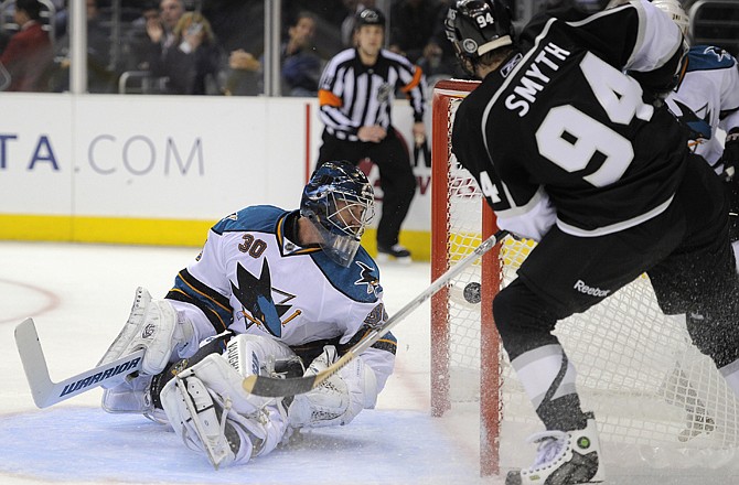 Los Angeles Kings left wing Ryan Smyth, right, scores on San Jose Sharks goalie Antero Niittymaki of Finland during the second period in Game 3 of a first-round NHL Stanley Cup playoffs hockey series, Tuesday, April 19, 2011, in Los Angeles.