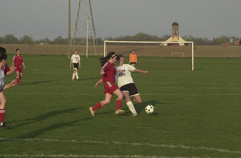 Ryan Boland/FULTON SUN photo: Junior forward Lola Weiss - shown getting a shot off against a Mexico player in last Wednesday night's 2-1 loss to the Lady Bulldogs - was one of four Fulton players named to the all-tournament team Saturday at the Lady Spartan Invitational in Moberly. Weiss was joined by senior midfielder Kara Henry, sophomore stopper Anna Fink and junior sweeper Rebecca Revak. 