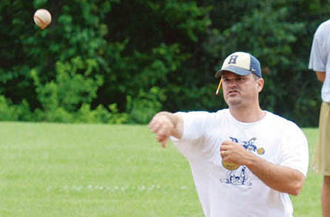 Chris Wyrick, shown here during a drill at his youth baseball clinic in the summer of 2010, stepped down in April 2011 as head coach of the Helias Crusaders. A month later, it was announced he's coming back to the position.