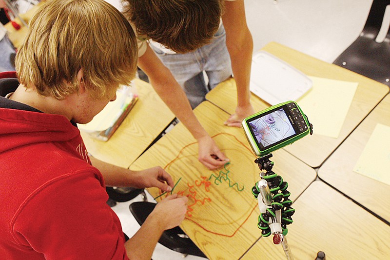 Contributed photo: Students in Carol Robertson's biology class use cameras purchased through a Fulton Public Schools Foundation grant to make stop-action videos of mitosis and meiosis using pipe-cleaner models for chromosomes.