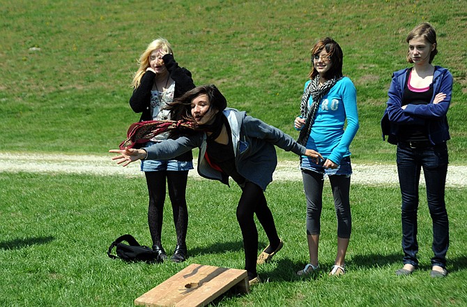 From left: Zoe Groset, Caroline Roadet, Hannah Holt and Samantha Miller play washers Thursday afternoon at Thomas Jefferson Middle School. Thirty students and three professors from a school in Lyon, France, are spending two weeks visiting members of the TJMS French Club. In May, the students from Jefferson City will travel to Lyon for a similar visit.