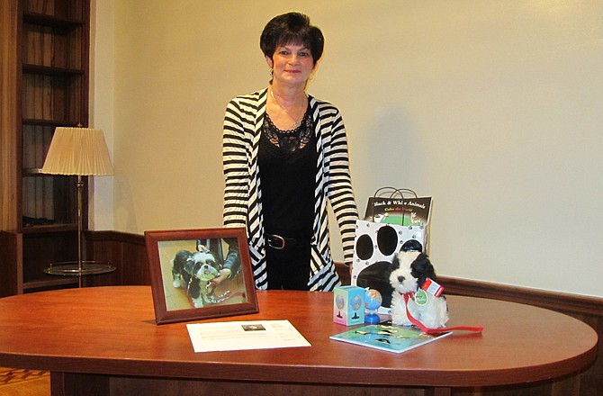 Carolyn Oetting self-published her book "Black and White Animals Color the World," which features her black and white Shih Tzu, Liza Janie. A gift set with her book even includes a stuffed Liza Janie dog.