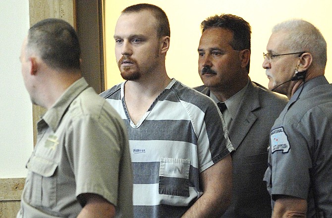 Joshua Maylee, Holts Summit, is shown entering the Callaway County Circuit Court on Friday, April 22, 2011, on charges of murdering three people.