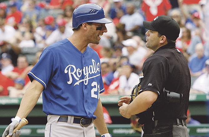 Jeff Francoeur of the Royals argues with home plate umpire Brian Knight after being called out on strikes in the eighth inning of Sunday's game with the Rangers in Arlington, Texas. Francoeur was ejected from the game.

