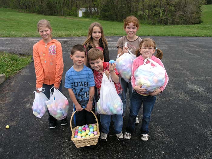 Children collected enough Easter eggs to fill their bags at the Easter Egg Hunt.