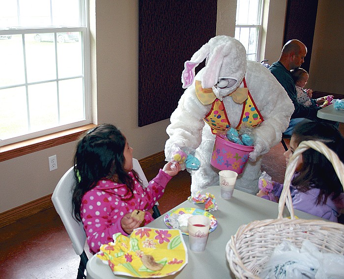 Participants of the Prairie Home Easter Egg Hunt enjoy treats served at the Prairie Home United Methodist Church Fellowship Hall and hand puppets from the Easter Bunny after the hunt Saturday morning.