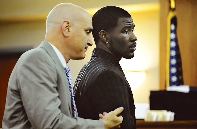 Derrick Washington (right), shown with attorney Christopher Slusher at the Boone County Courthouse in Columbia, will be the subject of two criminal trials in the coming weeks.