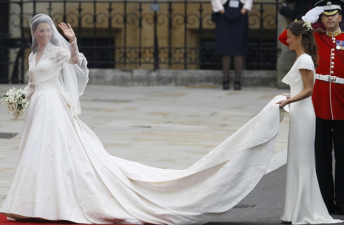 Kate Middleton arrives at Westminster Abbey in her Sarah Burton dress. Her maid of honor and sister, Pippa Middleton, carried the train.