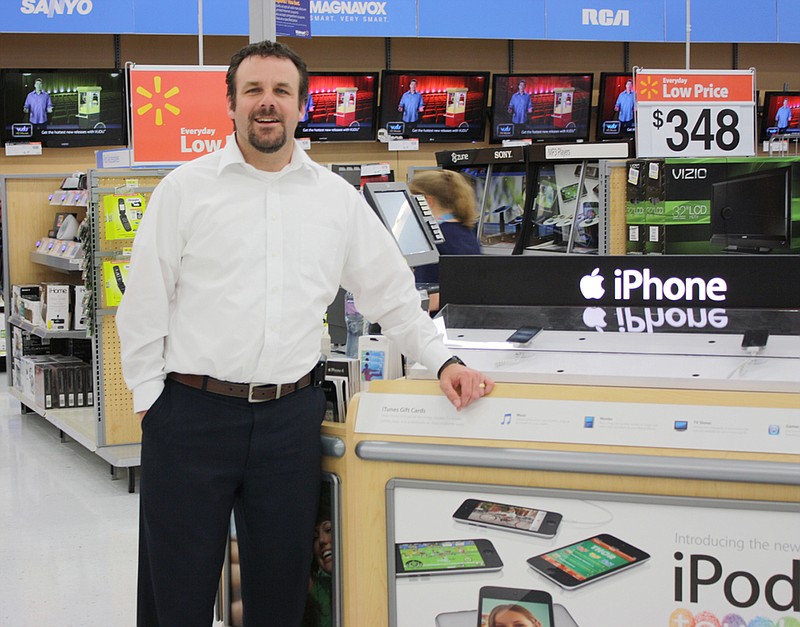 Don Norfleet/FULTON SUN photo: Tony Loehr, Fulton Walmart manager, at the newly expanded Electronics Department in the redesigned supercenter. The store will celebrate its grand reopening today.