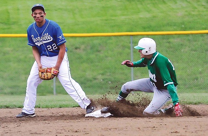 Adam Bax of Blair Oaks slides into second base during Monday's game against Booneville at the Falcon Sports Complex in Wardsville.